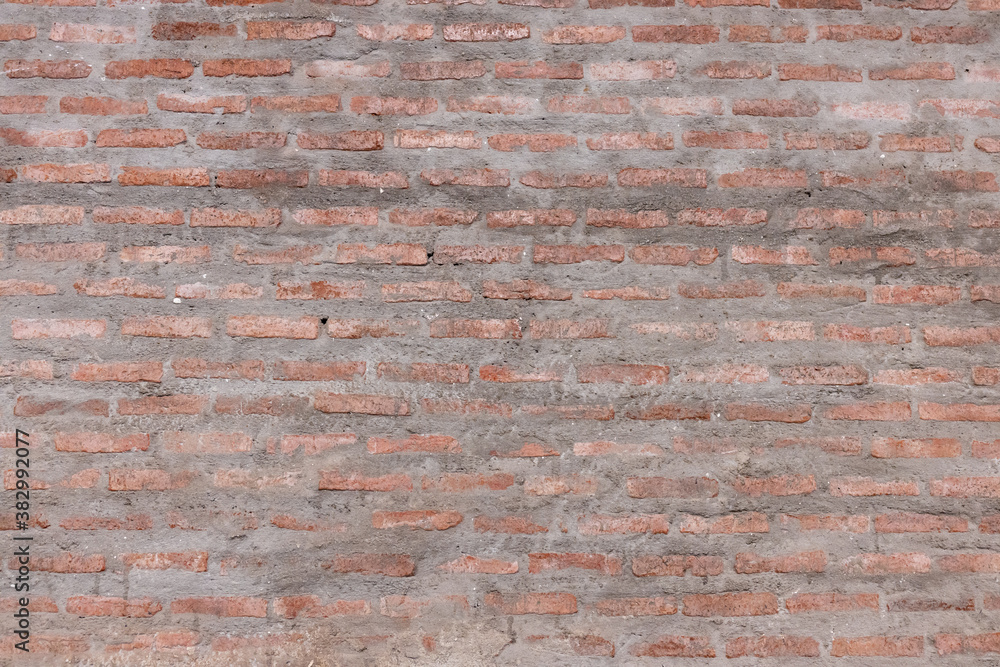 orange brick in gray concrete or cement wall texture background
