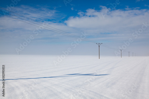 Winter landscape with power line columns © Radomir Rezny
