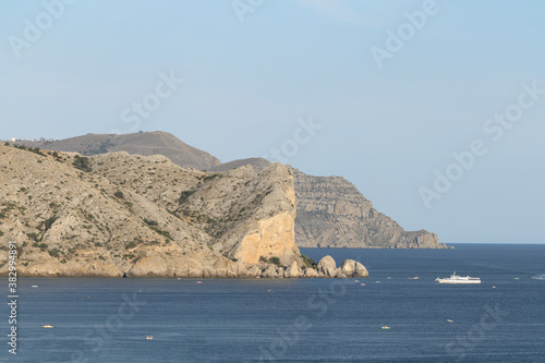 panorama of the sea and cliffs and a yacht