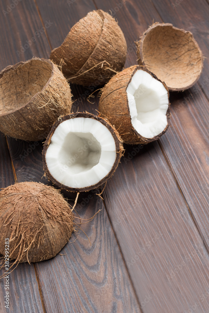 Two halves of fresh coconut and coconut shell Two halves of fresh coconut and coconut shell