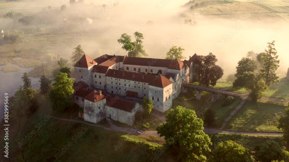 Svirzh castle among the fog at sunrise Aerial 4K Svirzh castle among the fog at sunrise Aerial 4K