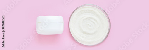 Collagen white powder. Pastel color background. Health product. Woman cosmetics concept. Sport supplement. Skincare cosmetics. Horizontal banner. Pink monochrome. Cream jar. Cream jar