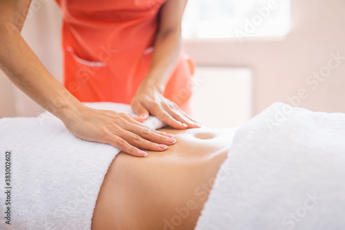 Wallpaper Mural Woman have belly massage in light procedure room. Anti-cellulite massage, diastasis Torontodigital.ca