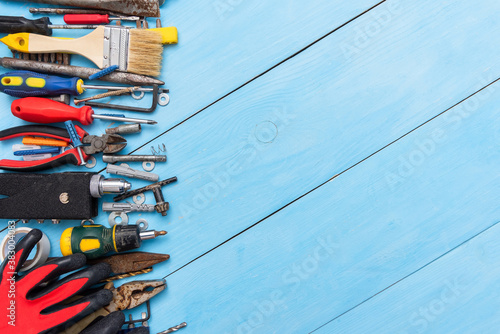 A set of old tools on a blue background.