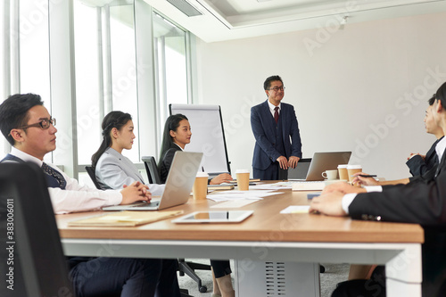 team of asian business people meeting in office