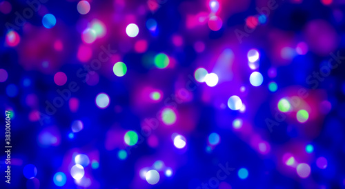 Sparkling colorful little circle on blurred background