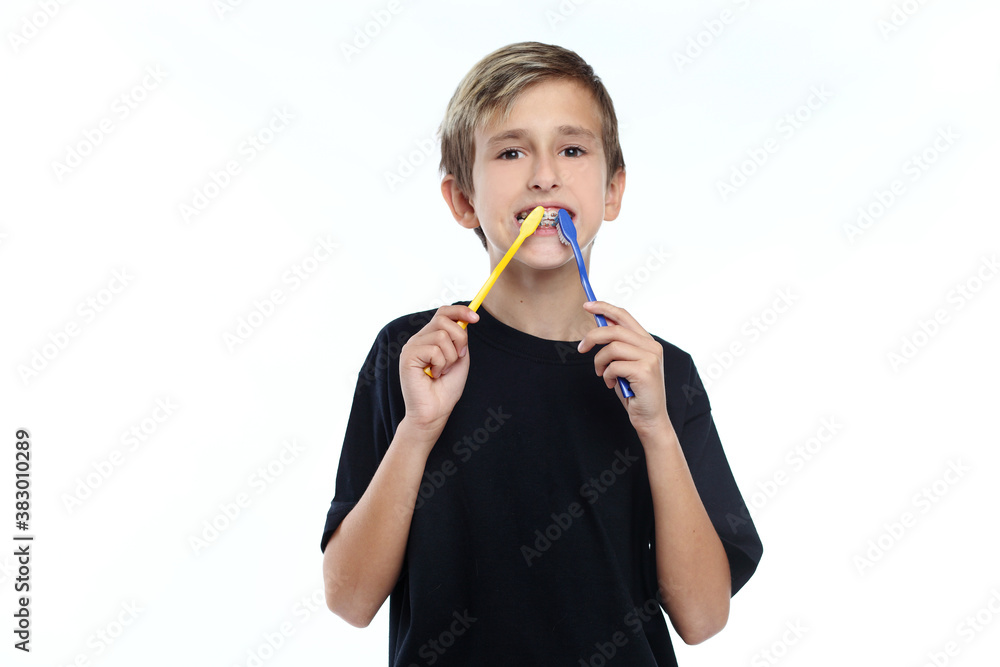 boy cleaning his teeth over white background boy cleaning his teeth over white background