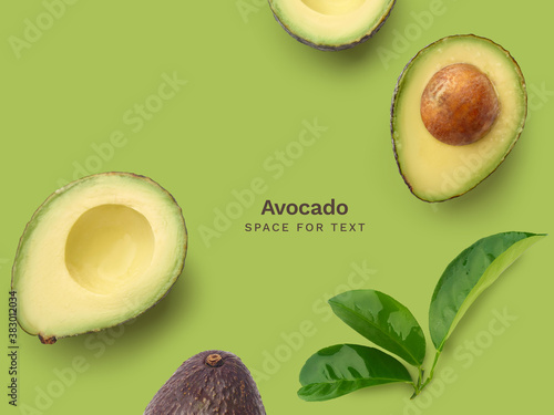 Flat lay with fresh ripe avocado whole and halved photo