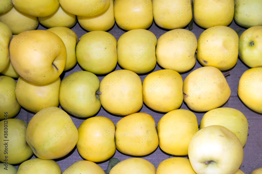 yellow apples in a market