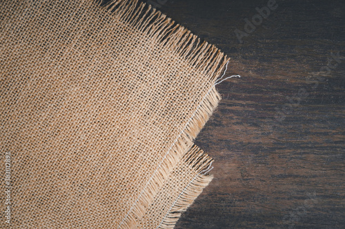 vintage hemp sack tablecloth on the old dark wooden table