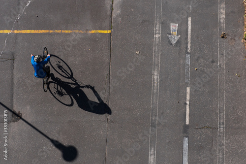 Topview on dirty asphalt road with grunge signs and bicycles with shadows