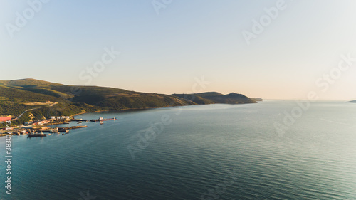 Sea bay surrounded by mountains. Peninsula Kony. The Sea of Okhotsk. Magadan Region. Russia. photo