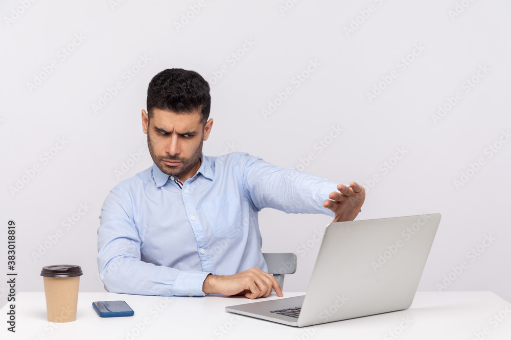 Don't want to look! Confused businessman sitting office workplace, showing stop to laptop screen, rejecting communication on video call, ignoring shameful gross web content. studio shot isolated Don't want to look! Confused businessman sitting office workplace, showing stop to laptop screen, rejecting communication on video call, ignoring shameful gross web content. studio shot isolated