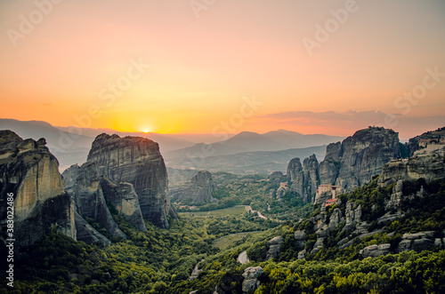A beautiful panoramic view of a sunset at the rock formation of Meteora in Greece