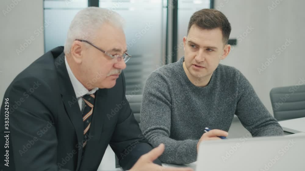 Business people working and planning in startup teamwork. 50s or 60s senior CEO and manager. Colleagues are working hard together and sitting in the office with laptop. Business people working and planning in startup teamwork. 50s or 60s senior CEO and manager. Colleagues are working hard together and sitting in the office with laptop.