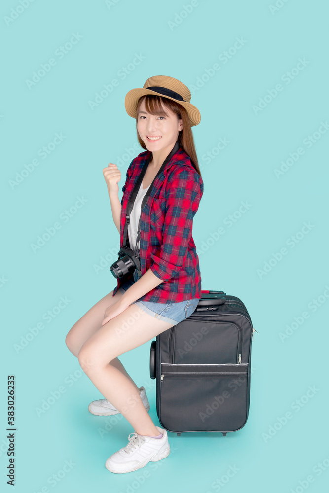 Beautiful portrait young asian woman sitting on luggage smile and travel summer trip for abroad in vacation, asia girl having camera gesture success and glad on suitcase for journey in holiday. Beautiful portrait young asian woman sitting on luggage smile and travel summer trip for abroad in vacation, asia girl having camera gesture success and glad on suitcase for journey in holiday.
