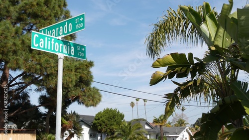 California street road sign on crossroad. Lettering on intersection signpost, symbol of summertime travel and vacations. USA tourist destination. Text on nameboard in city near Los Angeles, route 101 © Dogora Sun