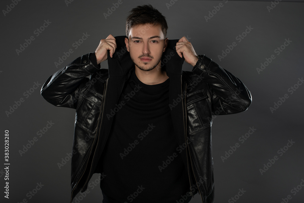 Portrait of an actor boy posing in studio on grey background. Isolated