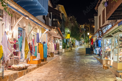 Street view in the Kas old town with boutique shops at evening, Turkey