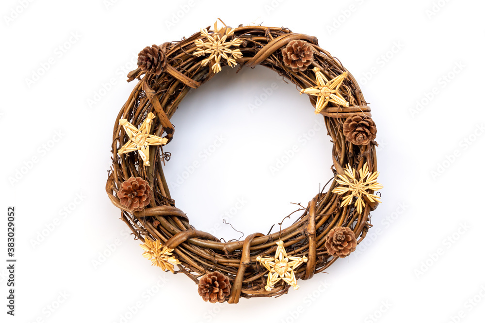 Fototapeta premium Rustic wooden Christmas wreath with pine cones isolated on whote background. Natural Christmas decoration