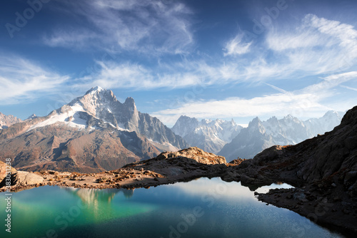 Fototapeta Naklejka Na Ścianę i Meble -  Incredible view of clear water and sky reflection on Lac Blanc lake in France Alps. Monte Bianco mountains range on background. Landscape photography, Chamonix.