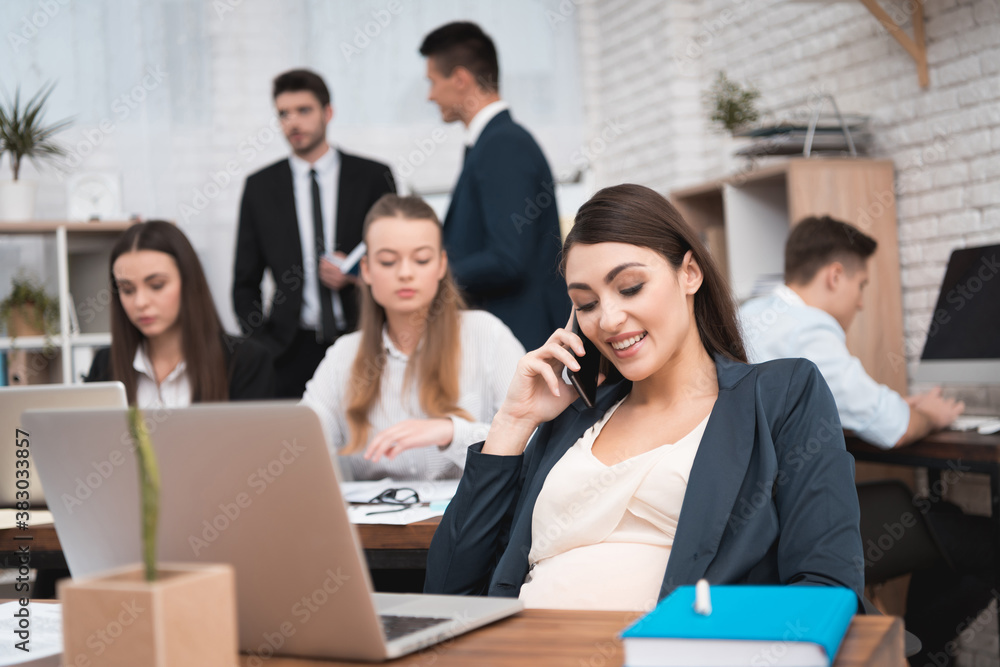 Beautiful pregnant woman speaks by phone. Beautiful pregnant woman speaks by phone.