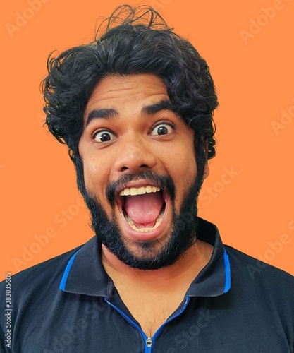 portrait of a man with an expression of excited look. © dineshthangappan