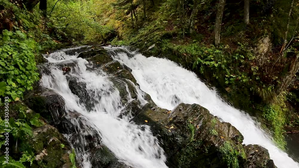 Wonderful waterfall on the mountain river Carpathians. Waterfall, fast mountain water, National Park of Skole Beskydy, Ukraine. Carpathian river, fast current, crystal water. Long exposure shot.
Wonderful waterfall on the mountain river Carpathians. Waterfall, fast mountain water, National Park of Skole Beskydy, Ukraine. Carpathian river, fast current, crystal water. Long exposure shot.