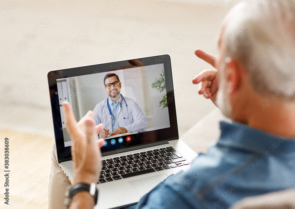 Senior man speaking with online doctor. - obrazy, fototapety, plakaty 