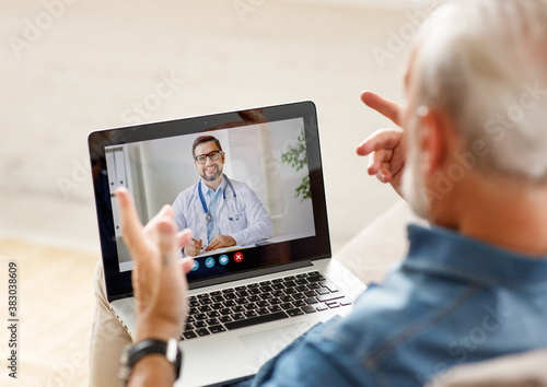 Senior man speaking with online doctor.