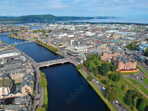Aerial view of Inverness city, showing the beauty of the River Ness with its famous bridges and landmarks the cathedral and castle in the background © Antony
