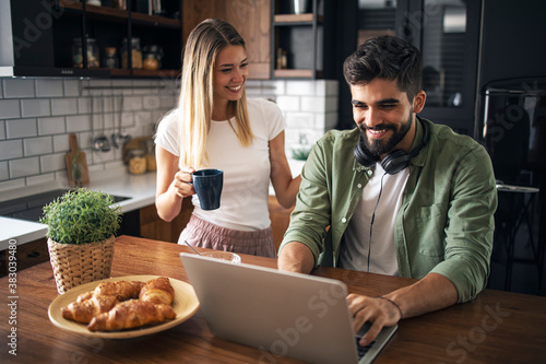 Young happy couple enjoying online shopping