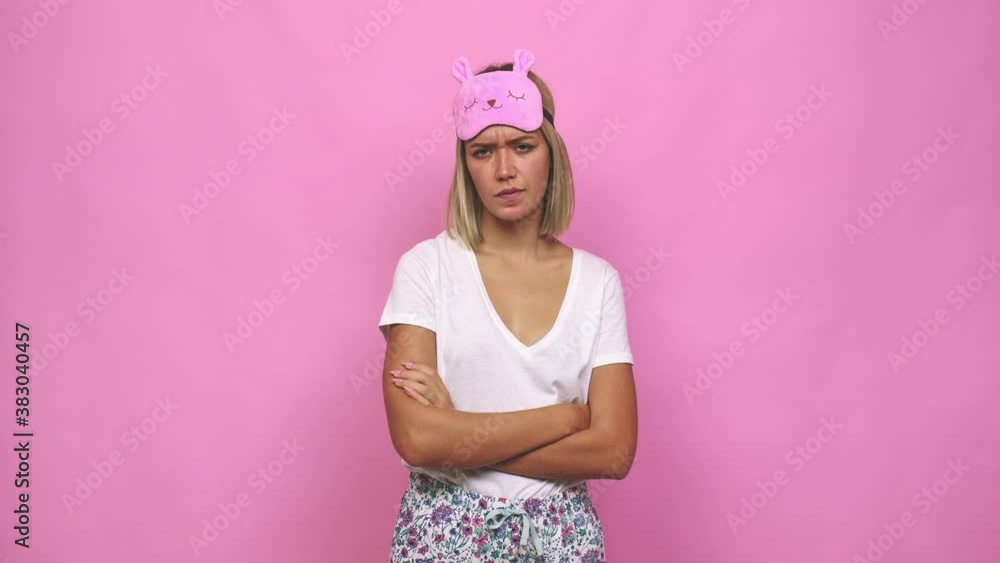 Young cute woman wearing pajama angry and in a bad mood Young cute woman wearing pajama angry and in a bad mood