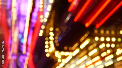 Defocused old fasioned electric lamps glowing at night. Abstract close up of blurred retro casino decoration shimmering, Las Vegas USA. Illuminated vintage style bulbs glittering on Freemont street. photo