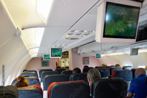 People in the cabin of a passenger plane before the flight