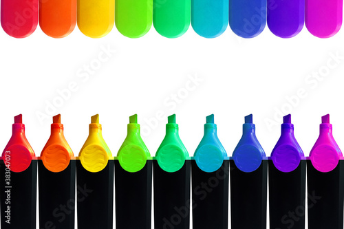 Colorful marker pen with colorful pen cap as boarder or frame on white background.