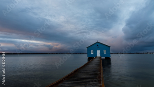 Blue boat shed on a rainy morning on the Swan River in Perth, Western Australia