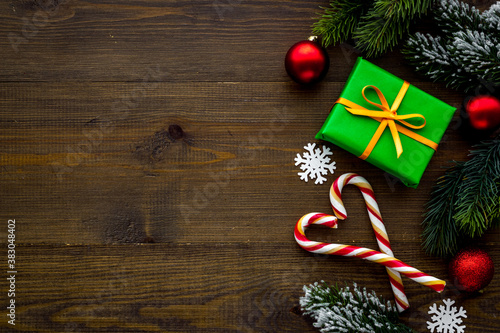 Dark Christmas layout with tree branches gifts and decorations