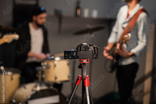music group bassist, lead guitarist and drummer conduct online broadcast of the concert from their Studio, record a video for the blog
