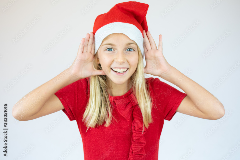 Close up portrait of a little girl in a red dress and red Christmas Santa hat Close up portrait of a little girl in a red dress and red Christmas Santa hat