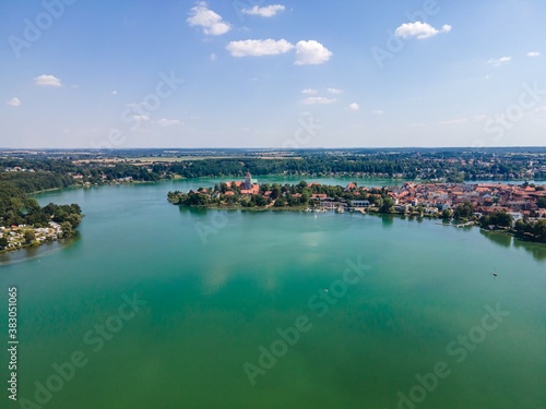 Idyllic  aerial view on Ratzenburger See. Lake with boats, sailboats, blue sky. Schleswig Holstein, Ratzenburg, Germany. © Mikalai