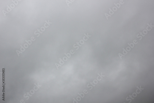 Gray rainy, covered with clouds, sky, cumulus dark clouds in the corner of the frame