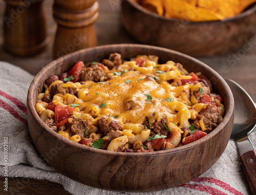Bowl of chili mac with cheddar cheese