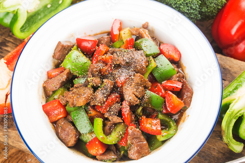 A plate of fried beef cubes with green pepper