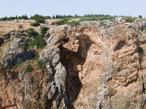 The Keshet  Cave - ancient natural limestone arch spanning the remains of a shallow cave with sweeping views near Shlomi city in Israel photo