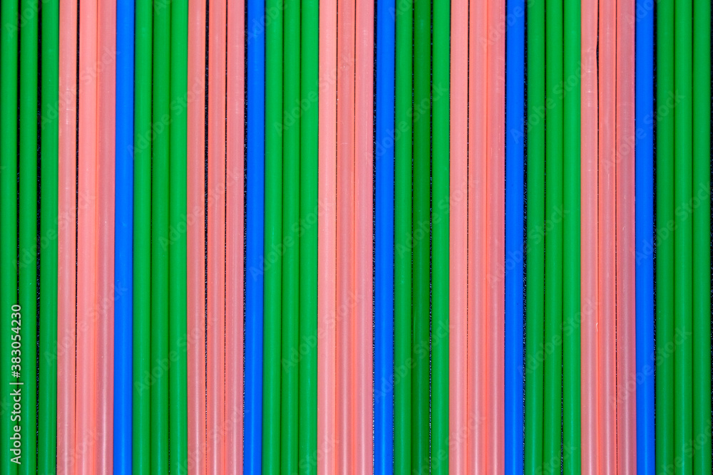 close-up on multi coloured plastic drinking straws in a row close-up on multi coloured plastic drinking straws in a row