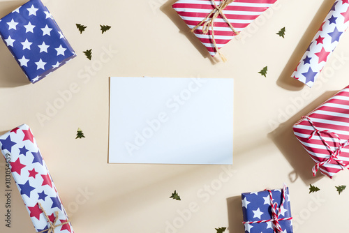 Greeting Christmas mockup card with colorful gift boxes.