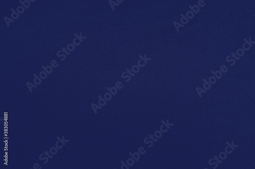Indigo homogeneous background with a textured surface, fabric.