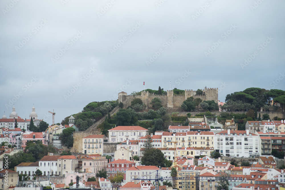 Lisbon - Portugal - 2 October 2020 - panorama with Saint Georges castle at the top of the mountain on cloudy sky background