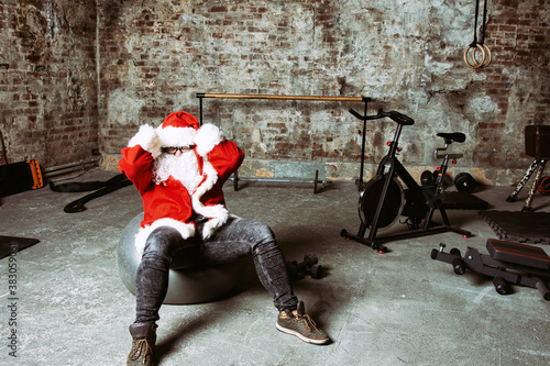 Funny fat Santa Claus, fitness club.